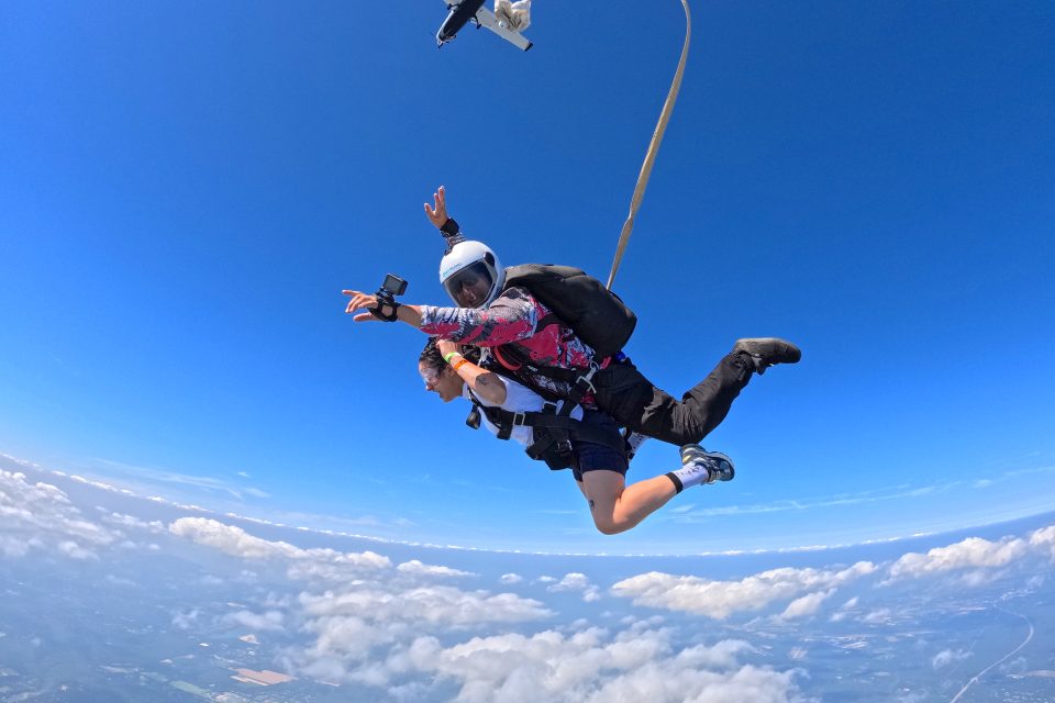 Skydiving above the New York clouds