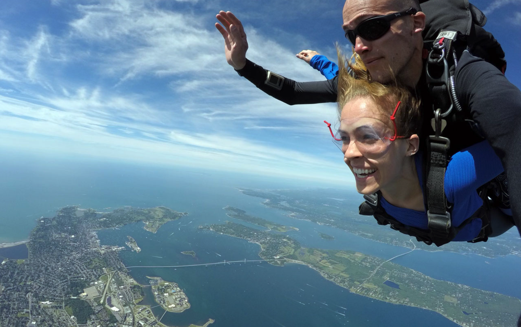 woman tandem skydiving with an instructor